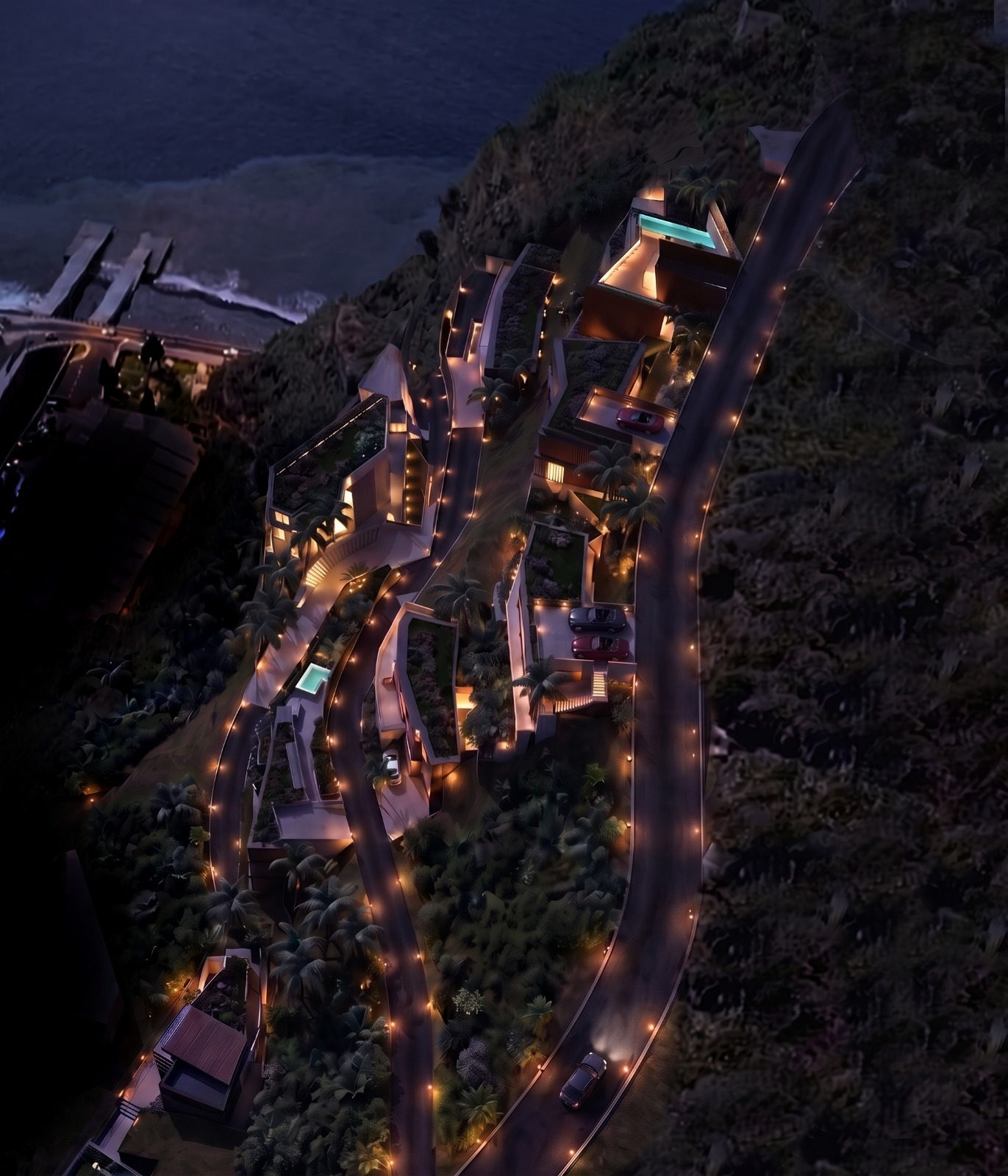 The ÆTHER hillside after dark, the Caminho da Praia lit as it descends to the shore